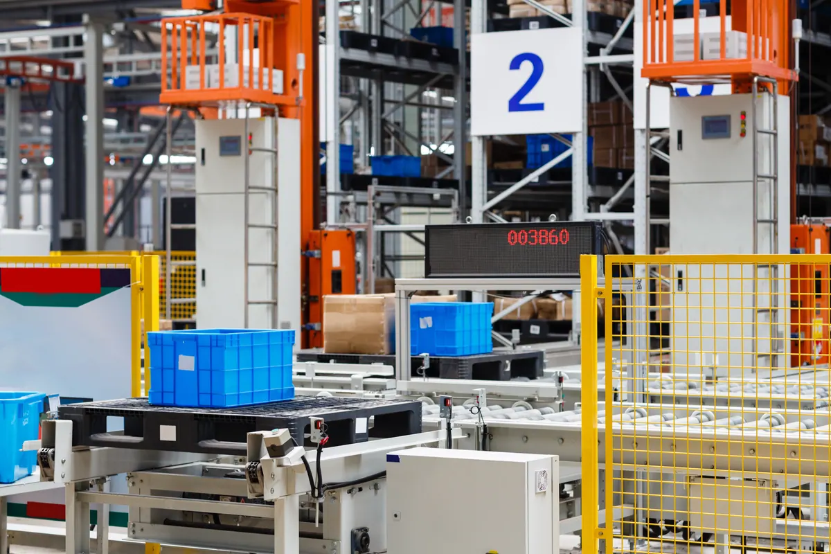 Totes moving along a conveyor past an order counter